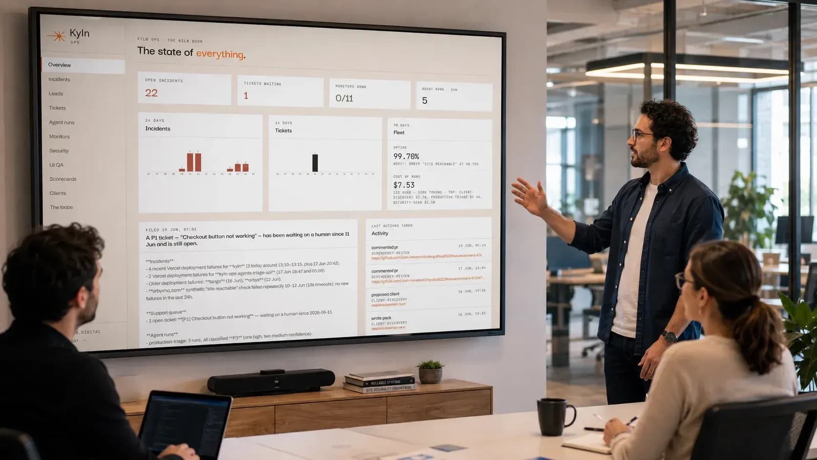 A Kyln team member presenting a live platform health dashboard to colleagues.